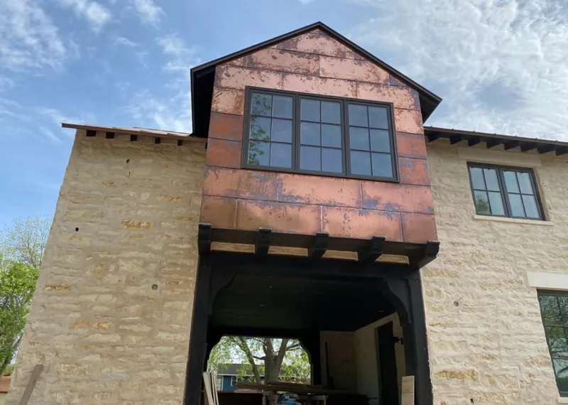 Copper metal panel facade on a stone building for Metal Roof Coating in Webster Groves