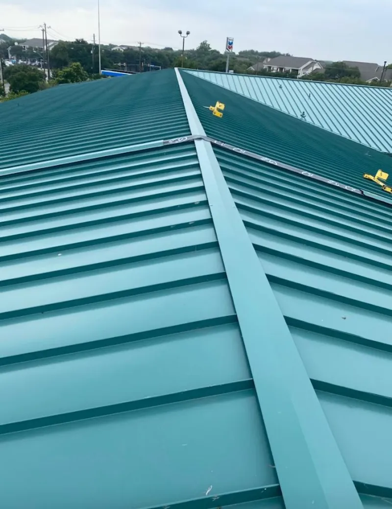 Green commercial metal roof ridge and valley for Metal Roof Repair in Webster Groves